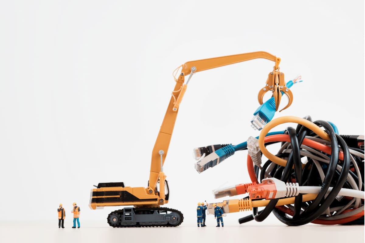 Mini people with a crane moving network cables