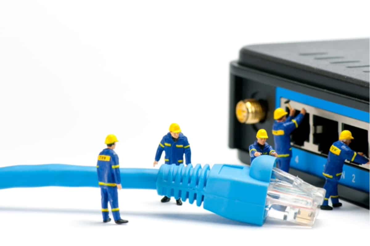 little people moving a network cable